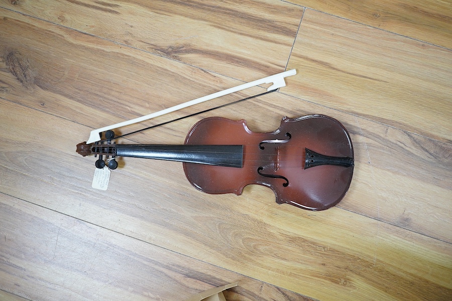 A quantity of violin parts and violins, a ukelele, a double bass scroll, a pinfold metronome, a violin case by Hill, a viola etc. Condition - for restoration